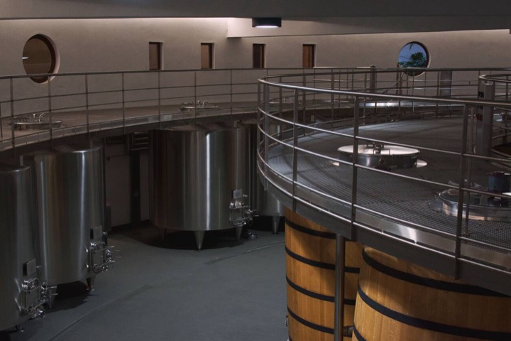 Steel tanks and barrels in a modern winery