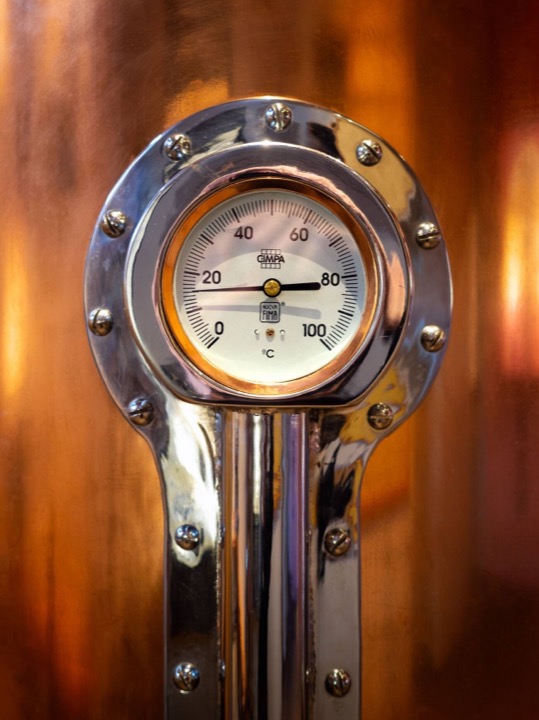 Industrial thermometer gauge on a wine tank